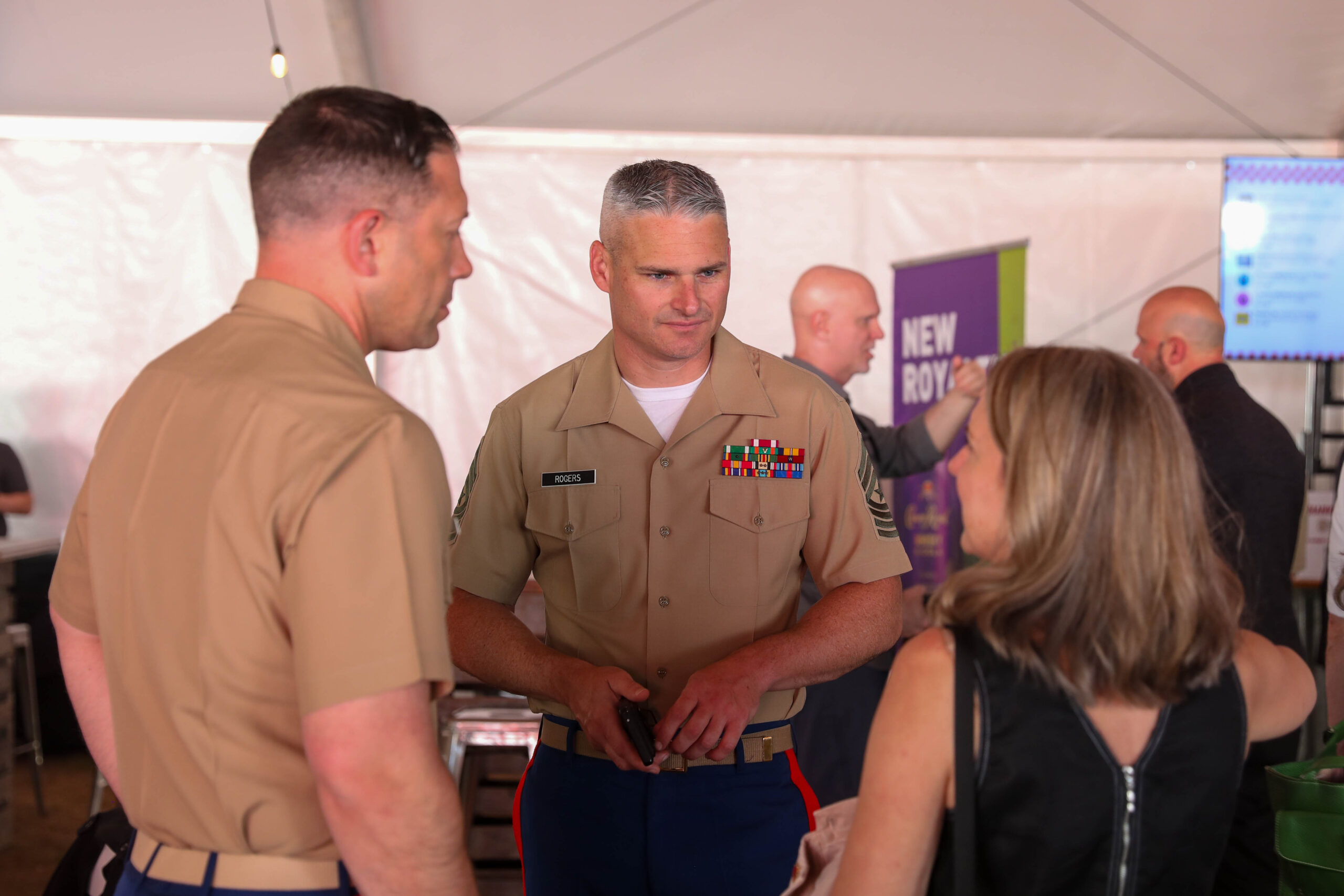 Speaking with attendees at Portland Fleet Week Sip to Shore Reception